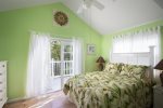 Master Bedroom is painted in lime green color and has queen bed 